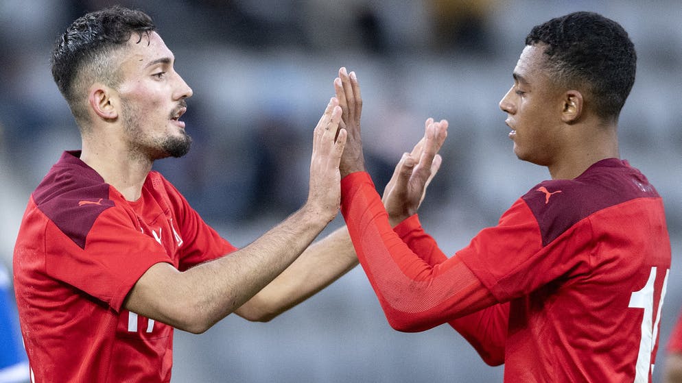 Swiss Andy Zakiri, left, and Dan Nadwi celebrate their second goal during a soccer qualifying match for the U-21 European Championship