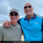 In this photo of Dwayne Johnson and Jeff Bezos

