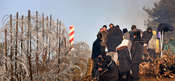 Once the border fence between Belarus and Poland is broken, migrants cross the border

