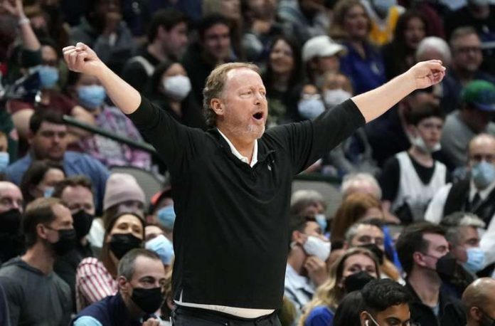 Milwaukee Bucks coach Mike Budenholzer shouts from the sidelines during the second half of an NBA game against the Dallas Mavericks in Dallas on Thursday, December 23, 2021. The Bucks won 102-95.  (AP Photo/LM Otero)