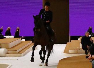 On the channel, Charlotte Kaziraki rides a horse on the catwalk

