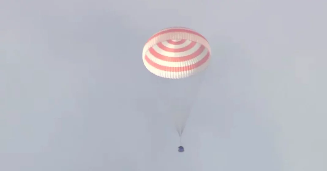 The Soyuz spacecraft landed, and a Russian and an American cosmonaut returned to Earth.

