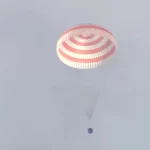 The Soyuz spacecraft landed, and a Russian and an American cosmonaut returned to Earth.

