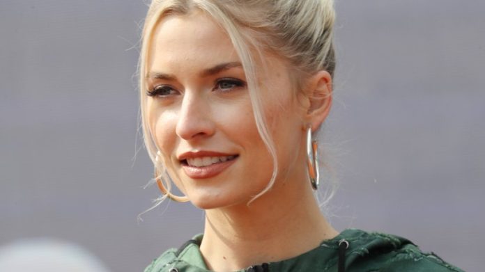 Lena Gercke shows off what she's wearing underneath

