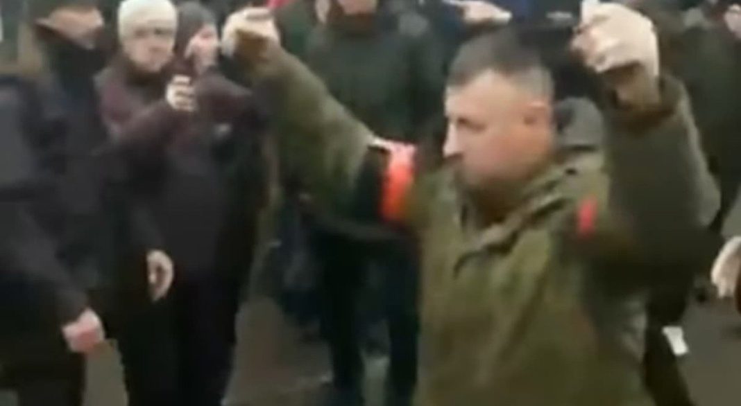 Ukraine, Russian soldier walking with two hand grenades, demanding surrender, crowd insults him: 'Shame'

