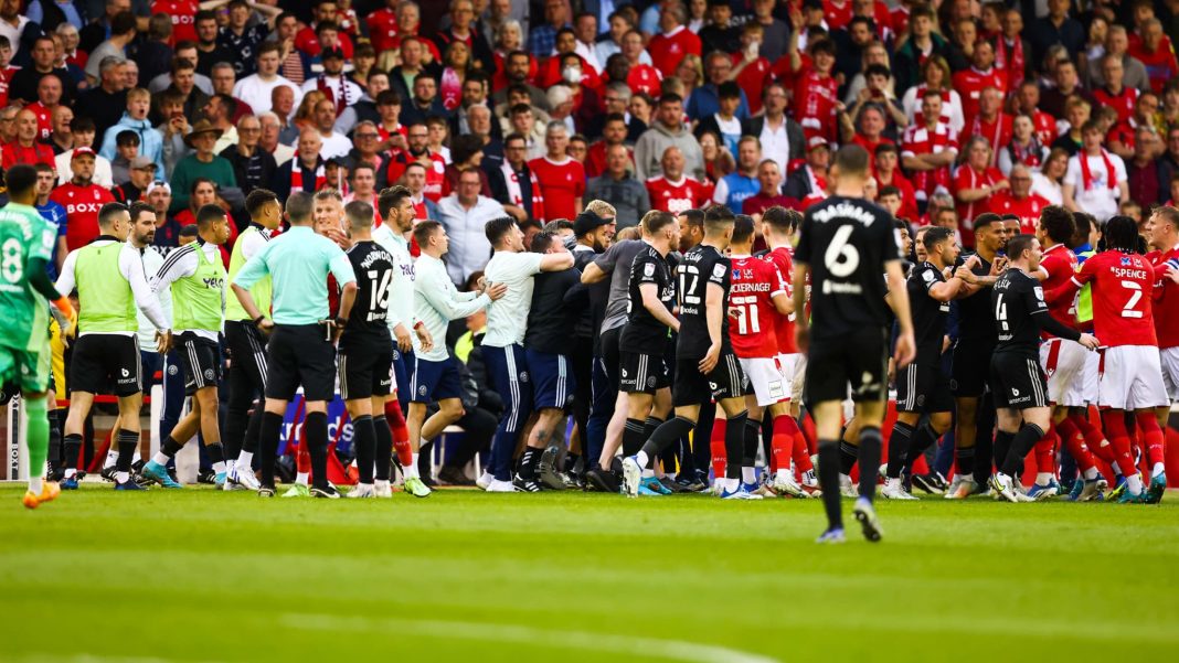 A Sheffield United player is violently attacked by a fan on the field

