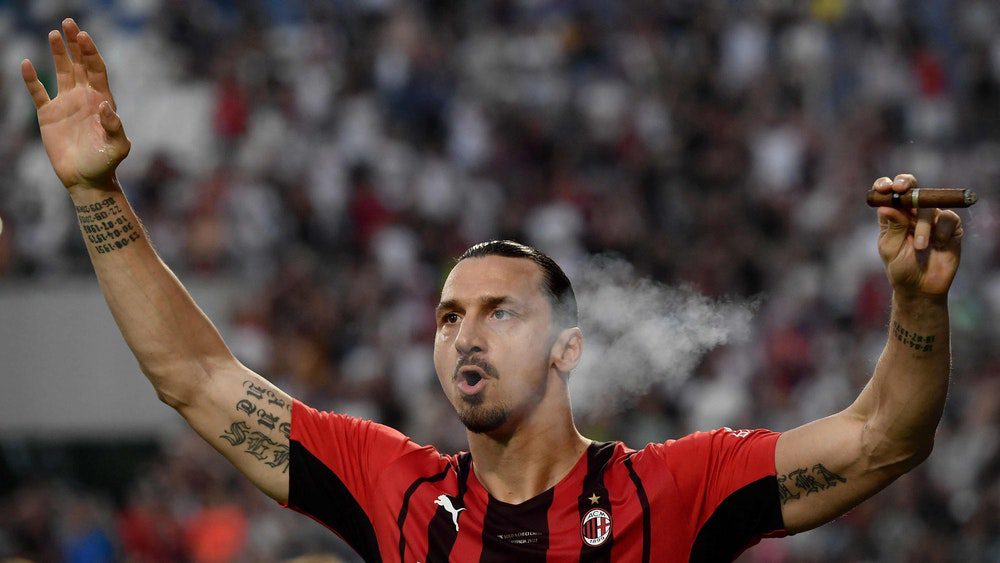 Sladen Ibrahimovic celebrates winning AC Milan title with a cigar.