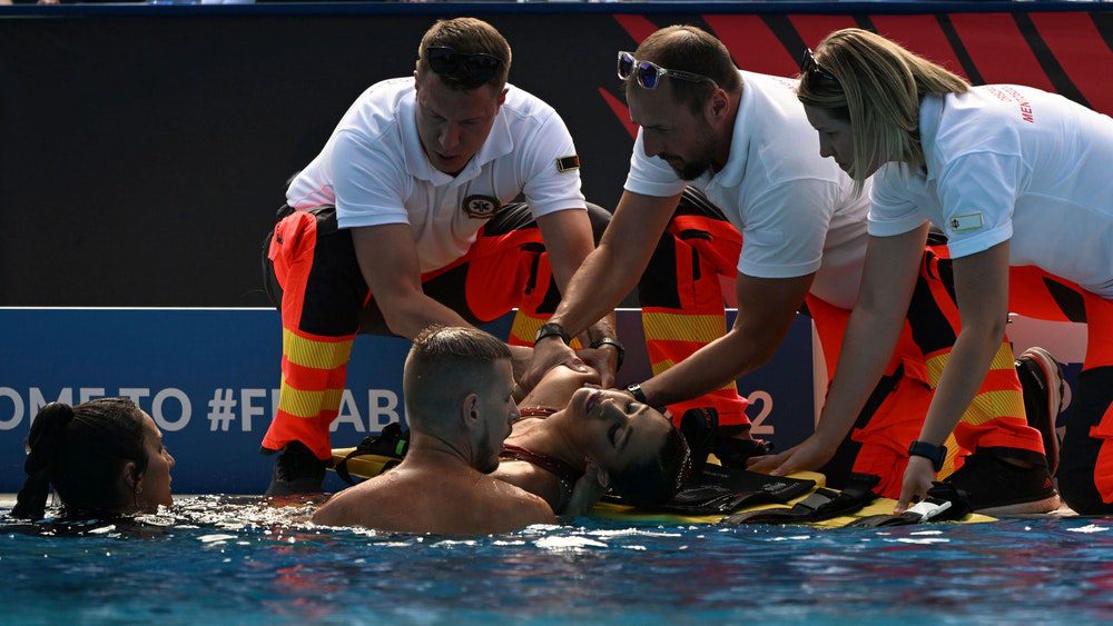 After being rescued from the water at the World Swimming Championships in Budapest, Anita Alvarez was greeted by paramedics at the edge of the pool.